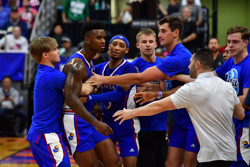 Players from Kansas and Marquette were involved in a courtside disagreement during the first half on Tuesday. (Steven Erler-USA TODAY Sports)