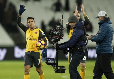 Britain Football Soccer - West Ham United v Arsenal - Premier League - London Stadium - 3/12/16 Arsenal's Alexis Sanchez celebrates with the match ball after the game Action Images via Reuters / John Sibley Livepic