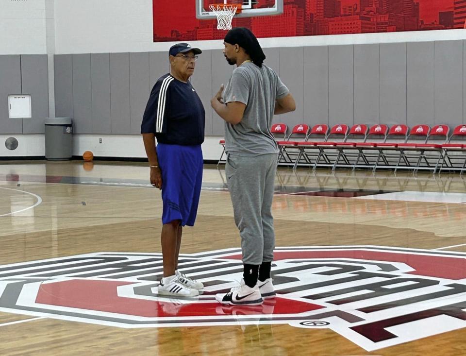 Carmen's Crew coach Jared Sullinger (right) talks to his dad and assistant coach, Satch, before the team's practice.