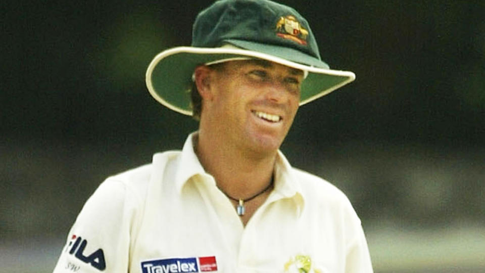 Shane Warne is pictured wearing his baggy green cap during a Test match in 2004.