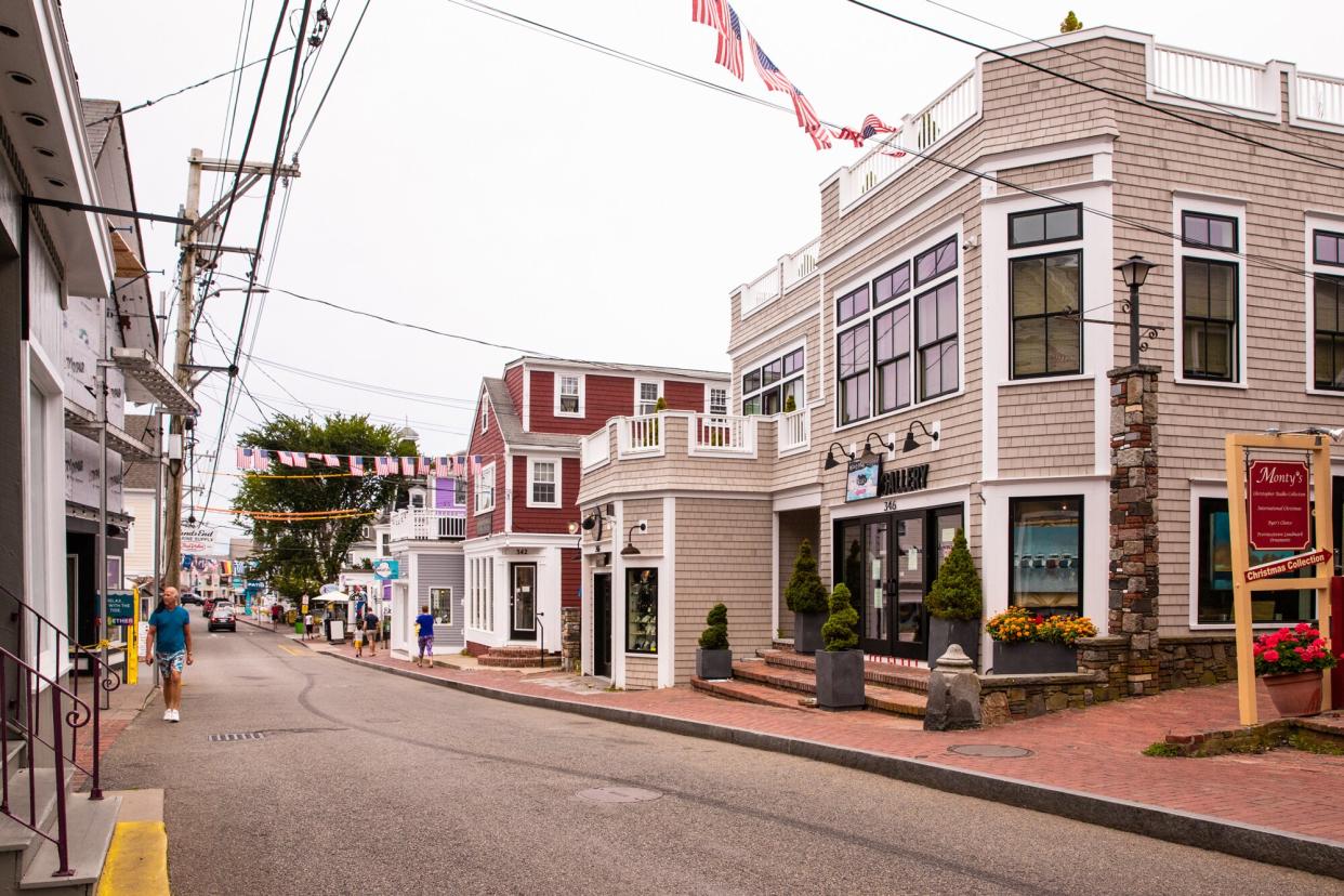 Provincetown, Massachusetts, USA - July 30, 2020: Street scene in Provincetown, MA on Cape Cod in historic tourist district with people visible.