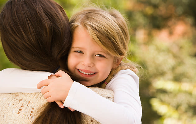 child hugging mother