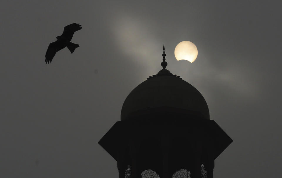 A partial solar eclipse is seen from Lahore, Pakistan, Thursday, Dec. 26, 2019. The last solar eclipse of 2019 was witnessed in Pakistan along with several other countries. (AP Photo/K.M. Chaudary)