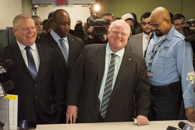 Toronto Mayor Rob Ford registers as a candidate Thursday, Jan. 2, 2014 for the city's 2014 municipal election in October. Councillor Doug Ford is at left. THE CANADIAN PRESS/Victor Biro