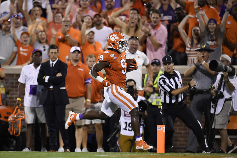 CLEMSON, SOUTH CAROLINA - AUGUST 29: Running back Travis Etienne #9 of the Clemson Tigers rushes for a 90-yard touchdown during the first quarter of the Tigers' football game against the Georgia Tech Yellow Jackets at Memorial Stadium on August 29, 2019 in Clemson, South Carolina. (Photo by Mike Comer/Getty Images)