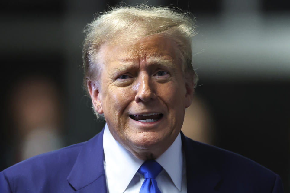 Former President Donald Trump speaks to media as he returns to his trial at the Manhattan Criminal Court, Friday, May 3, 2024, in New York. (Charly Triballeau/Pool Photo via AP)