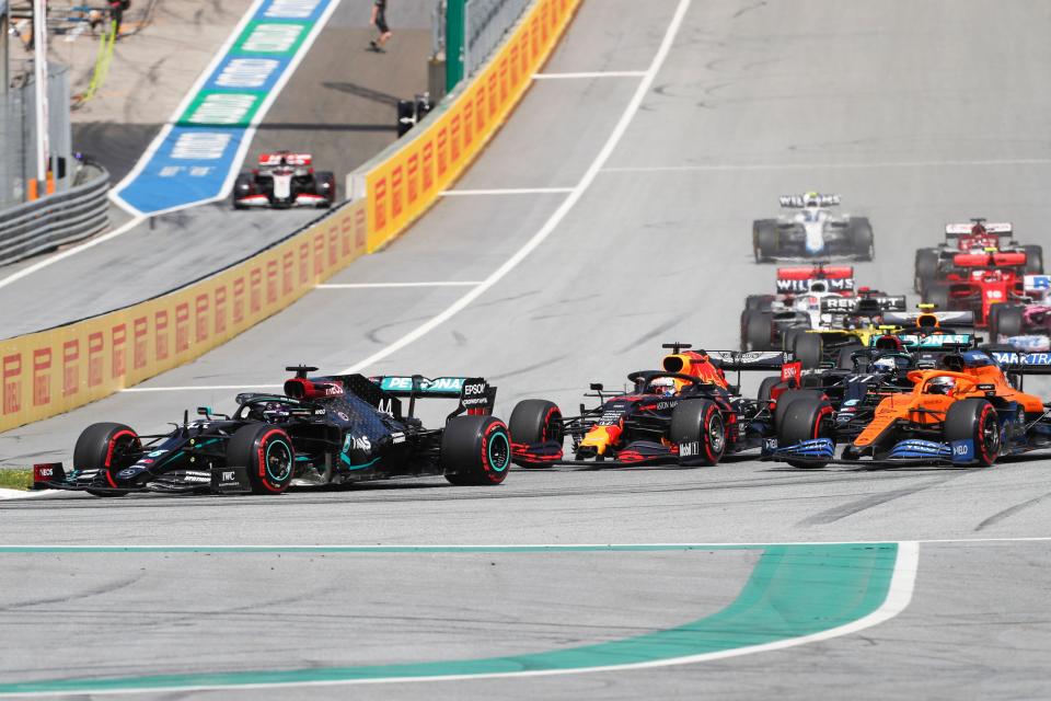 Mercedes' British driver Lewis Hamilton (L) leads from the pole position at the start of the Formula One Styrian Grand Prix race on July 12, 2020 in Spielberg, Austria. (Photo by Darko Bandic / POOL / AFP) (Photo by DARKO BANDIC/POOL/AFP via Getty Images)