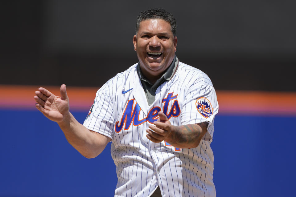 Former New York Mets pitcher Bartolo Colon throws the ceremonial first pitch before a baseball game against the Colorado Rockies, Sunday, May 7, 2023, in New York. (AP Photo/John Minchillo)