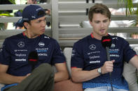 Williams drivers Alexander Albon, left, of Thailand and Logan Sargeant of the U.S., speak during an interview ahead of the Formula One Miami Grand Prix auto race at the Miami International Autodrome, Friday, May 3, 2024, in Miami Gardens, Fla. (AP Photo/Wilfredo Lee)
