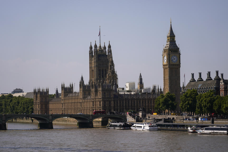 The palace of Westminster stands on the north bank of river Thames, in London, Monday, July 18, 2022. Britain’s first-ever extreme heat warning is in effect for large parts of England as hot, dry weather that has scorched mainland Europe for the past week moves north, disrupting travel, health care and schools. (AP Photo/Alberto Pezzali)
