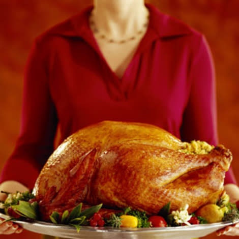 Woman holding a Thanksgiving turkey