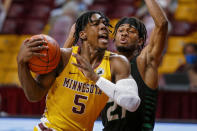 Minnesota guard Marcus Carr (5) drives to the basket past North Dakota guard Ethan Igbanugo (21) during the first half of an NCAA college basketball game Friday, Dec. 4, 2020, in Minneapolis. (AP Photo/Bruce Kluckhohn)