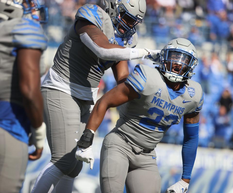 Memphis Tigers linebacker JJ Russell, right, celebrates his sack during their game against the SMU Mustangs at Liberty Bowl Memorial Stadium on Saturday Nov. 6, 2021.