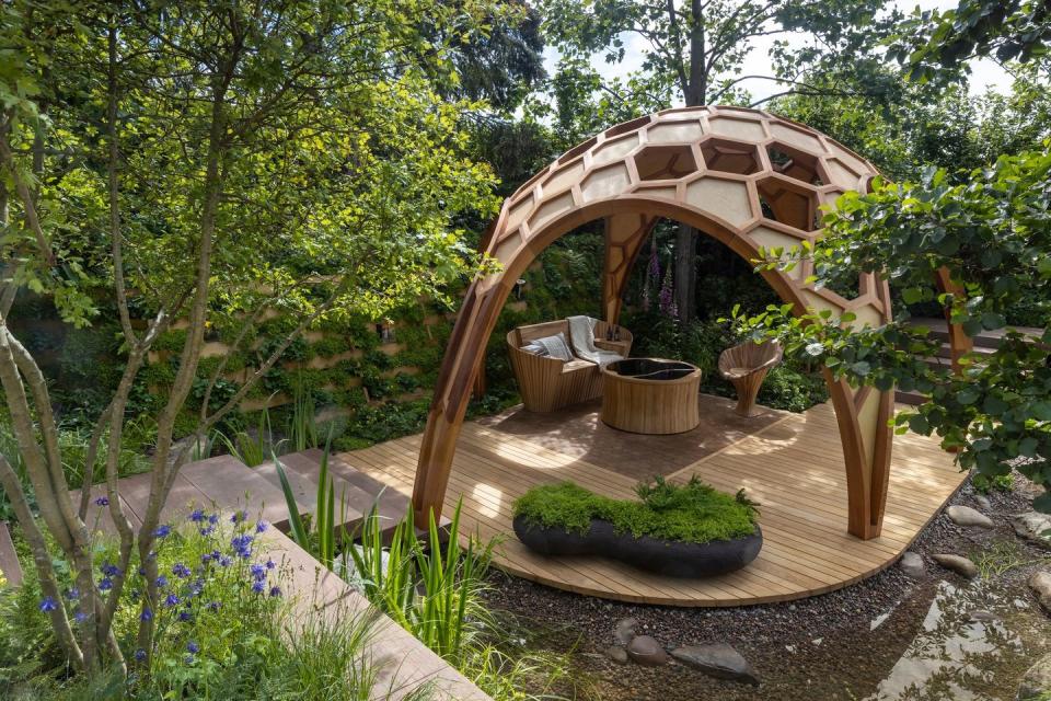 <p><strong>SHOW GARDEN | Award: GOLD</strong></p><p>Designed to emphasise the inseparable connection between plants and fungi within woodland ecosystems, the Meta garden by <a href="https://www.housebeautiful.com/uk/author/225569/joe-perkins/" rel="nofollow noopener" target="_blank" data-ylk="slk:Joe Perkins;elm:context_link;itc:0;sec:content-canvas" class="link ">Joe Perkins</a><span> highlights the beauty and versatility of timber, and the critical role of nature-based solutions, such as tree planting and forest management, in tackling climate change.</span></p><p>Central to this is a complex pavilion structure with a seating area sunken into the environment.</p>