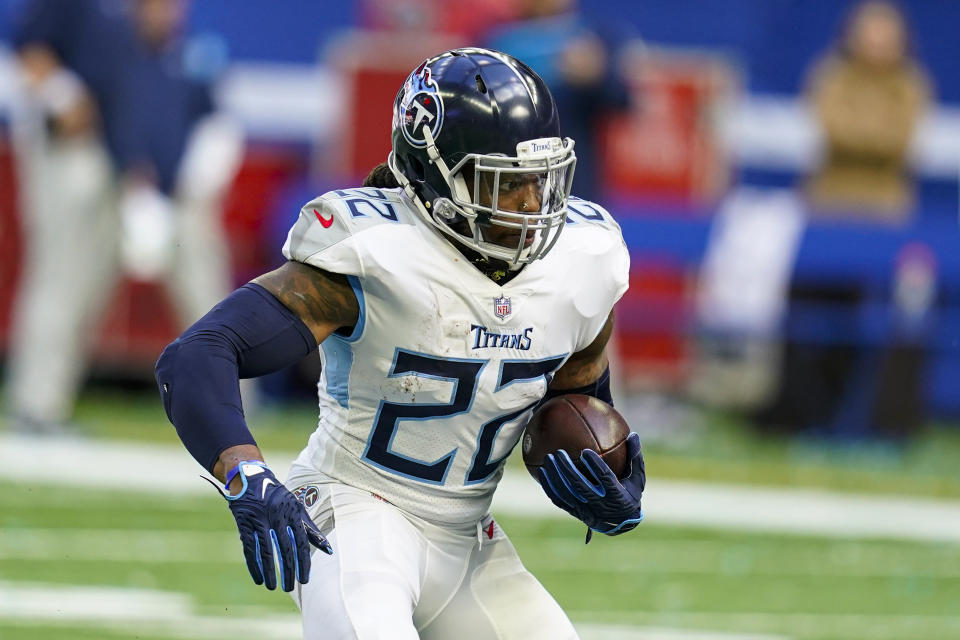 FILE - Tennessee Titans running back Derrick Henry runs against the Indianapolis Colts in an NFL football game in Indianapolis on Sunday, Oct. 31, 2021. The Titans have moved a step closer to having the 2020 AP NFL Offensive Player of the Year back, opening the 21-day window Wednesday, Jan. 5, 2022, for Derrick Henry to start practicing. (AP Photo/Darron Cummings, File)