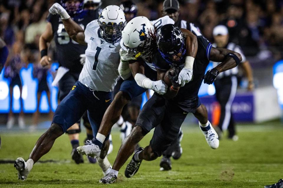 TCU wide receiver Savion Williams (3) gets tackled in the second half of a Big XII conference game between the TCU Horned Frogs and the West Virginia Mountaineers at Amon G. Carter Stadium in Fort Worth on Saturday, Sept. 30, 2023. The Horned Frogs lost 24-21. Chris Torres/ctorres@star-telegram.com