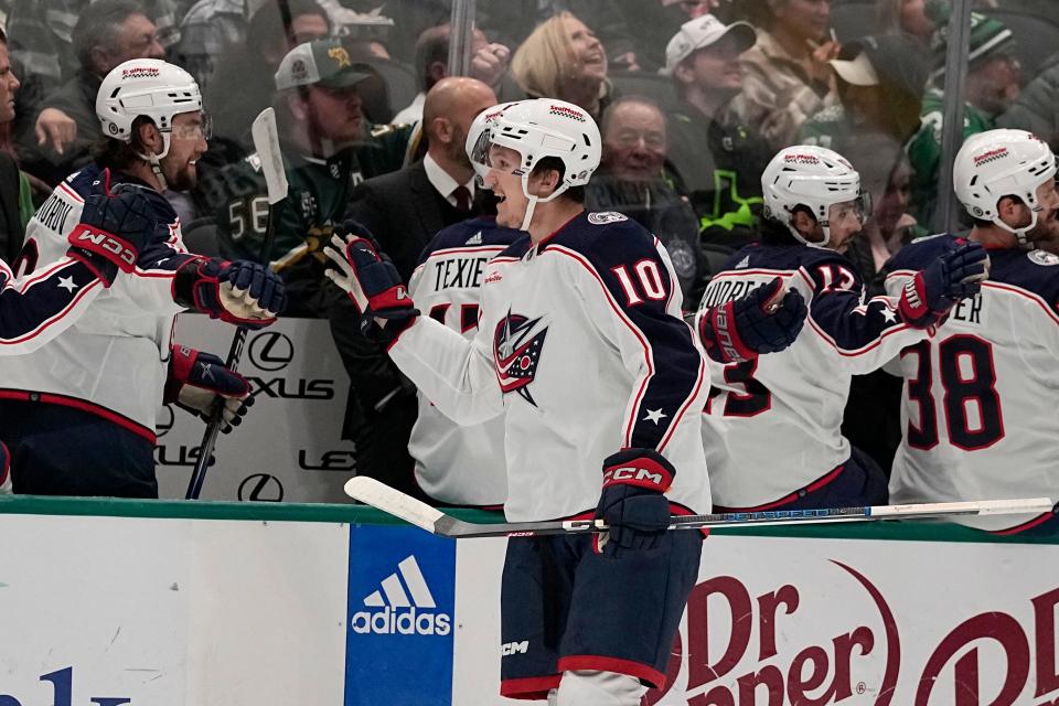 Columbus Blue Jackets' Dmitri Voronkov (10) celebrates with the bench after scoring against the Dallas Stars in the first period of an NHL hockey game, Monday, Oct. 30, 2023, in Dallas. (AP Photo/Tony Gutierrez)