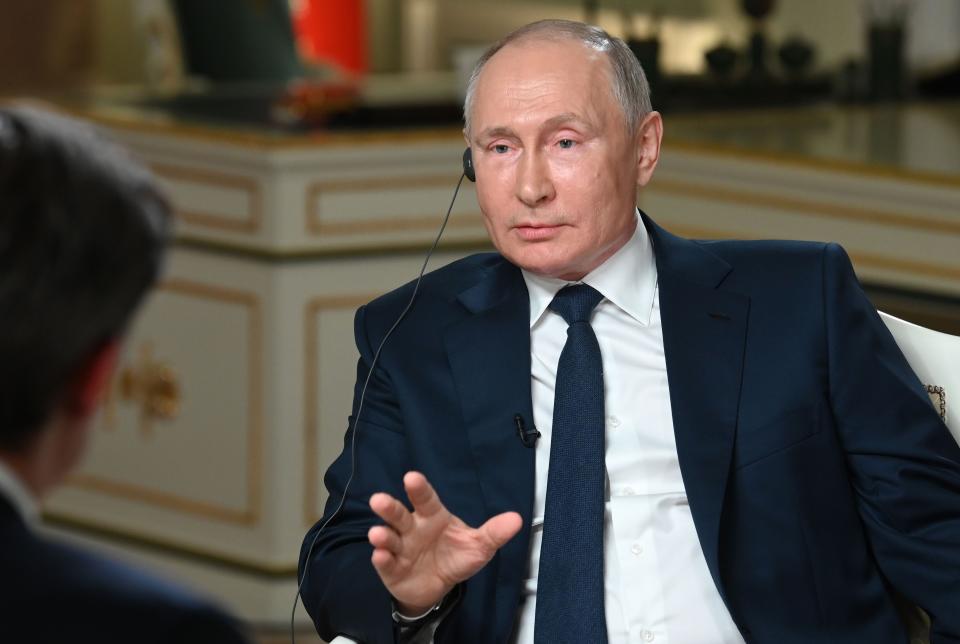 FILE - In this photo Russian President Vladimir Putin speaks to NBC News journalist Keir Simmons, back to a camera, in an interview aired on Monday, June 14, 2021, two days before the Russian leader is to meet U.S. President Joe Biden in Geneva. (Maxim Blinov, Sputnik, Kremlin Pool Photo via AP, File)