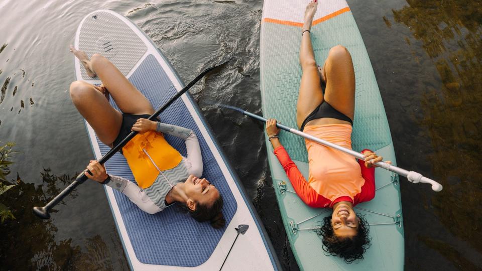 two women paddle boarding