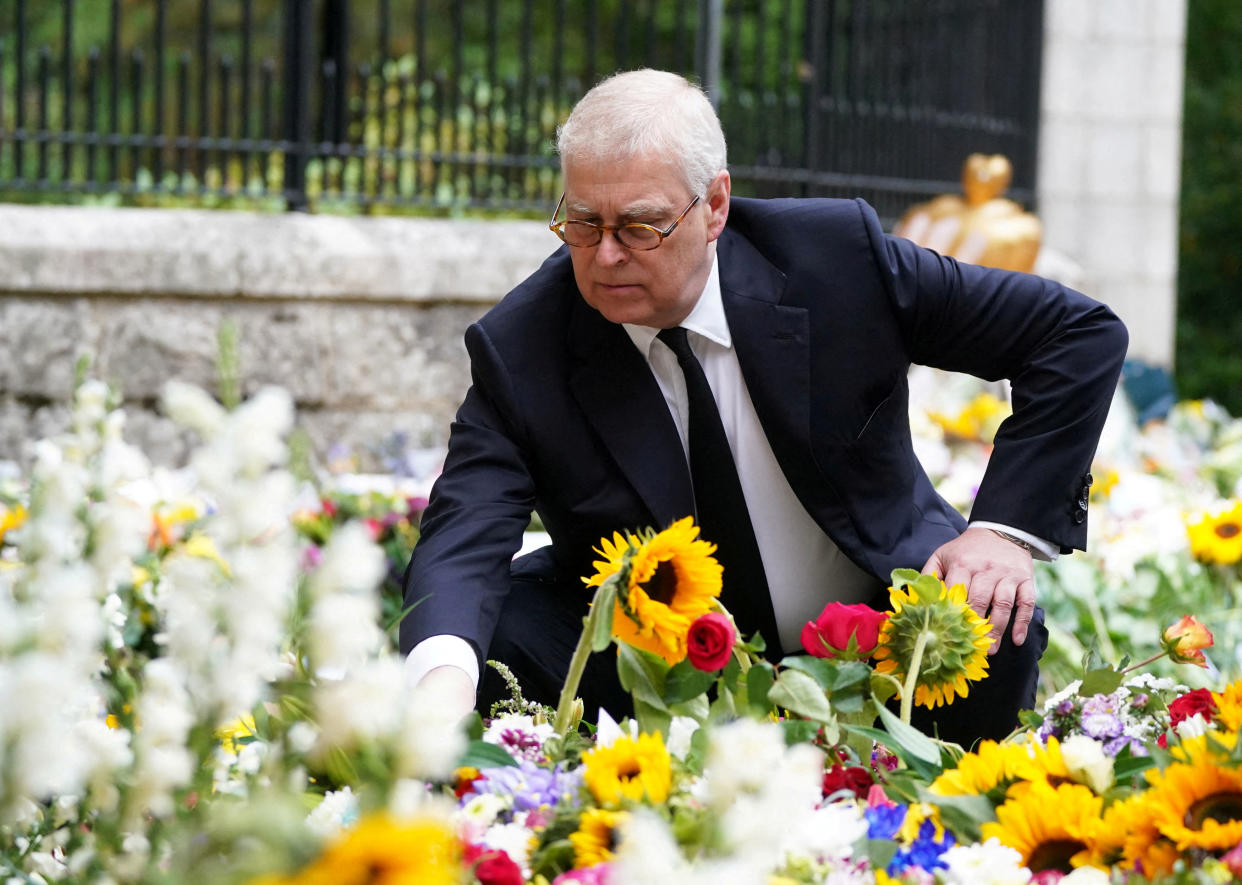 Britain's Prince Andrew, Duke of York views the messages and floral tributes left by members of the public, following the passing of Britain's Queen Elizabeth, in Balmoral, Scotland, Britain, September 10, 2022. Owen Humphreys/Pool via REUTERS