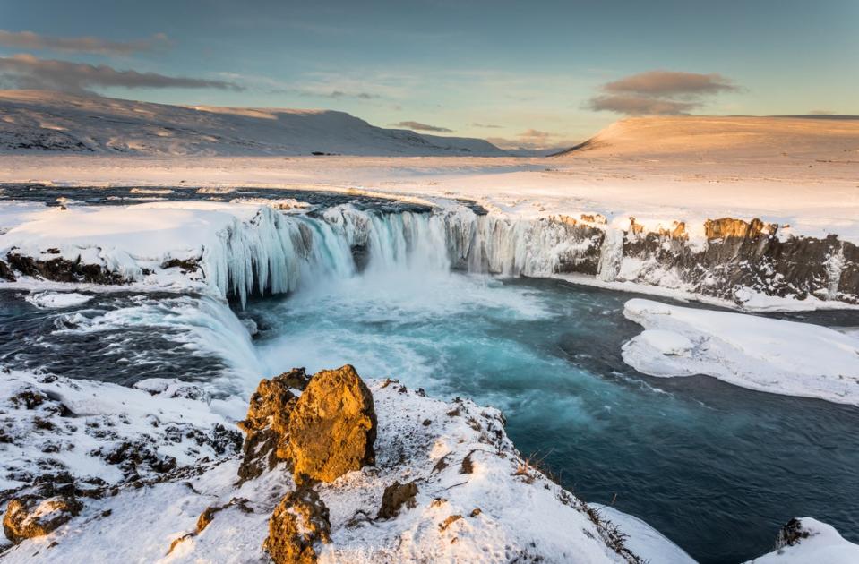 A sunrise over Godafoss Falls in northern Iceland (Getty Images)