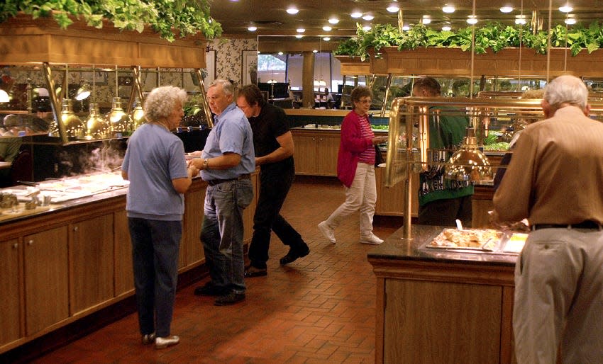 People getting their food at Old Country Buffet, located in Staples Center in Corpus Christi, on Nov. 20, 2001. The restaurant closed the following week.
