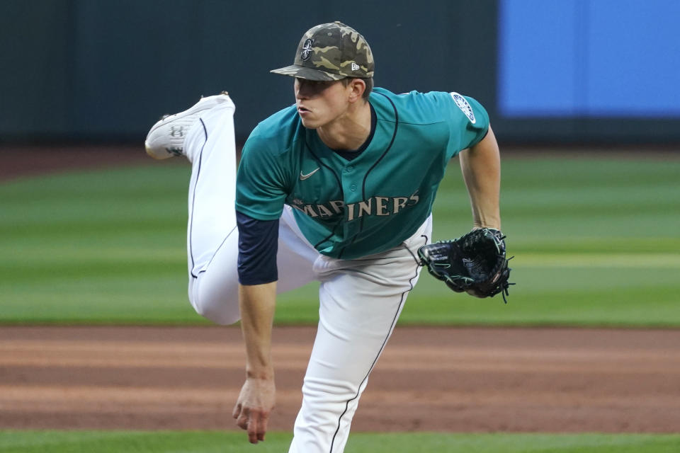 Seattle Mariners starting pitcher Chris Flexen follows through as he throws against the Cleveland Indians in the first inning of a baseball game Friday, May 14, 2021, in Seattle. (AP Photo/Elaine Thompson)