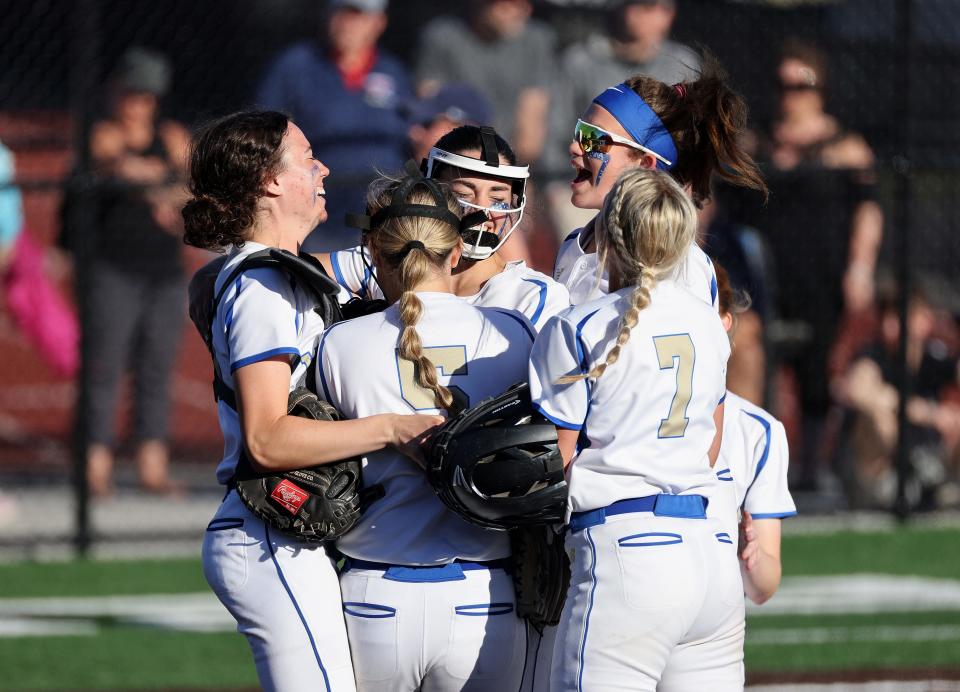 Schroeder players celebrate with pitcher Molly Broccolo after beating Thomas 6-2 for the Class A1 title. 