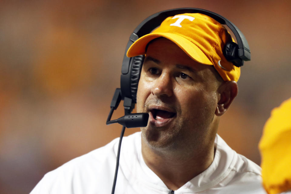 FILE - In this c, Tennessee head coach Jeremy Pruitt talks to a player in the second half of an NCAA college football game against Georgia in Knoxville, Tenn. Tennessee and Indiana are both in a bowl game for the first time in three years. It's progress for respective head coaches Jeremy Pruitt and Tom Allen. (AP Photo/Wade Payne, File)