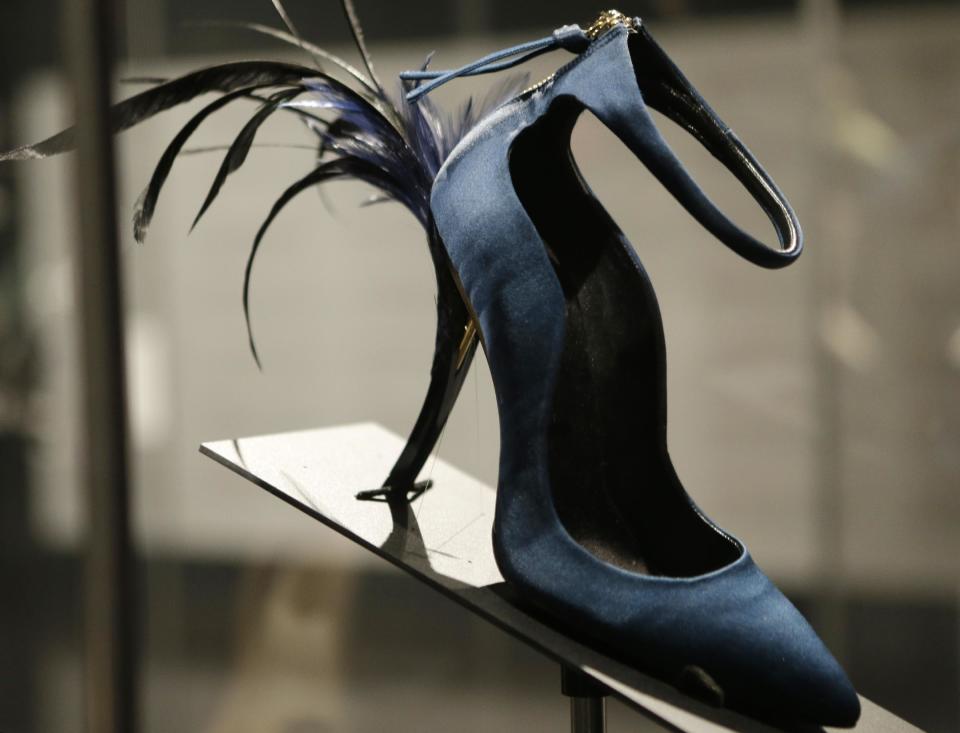 This Feb. 11, 2013 photo shows Roger Vivier's Eyelash Heel pump displayed at the "Shoe Obsession" exhibit at The Museum at the Fashion Institute of Technology Museum in New York. The exhibition, showing off 153 specimens, runs through April 13. (AP Photo/Kathy Willens)