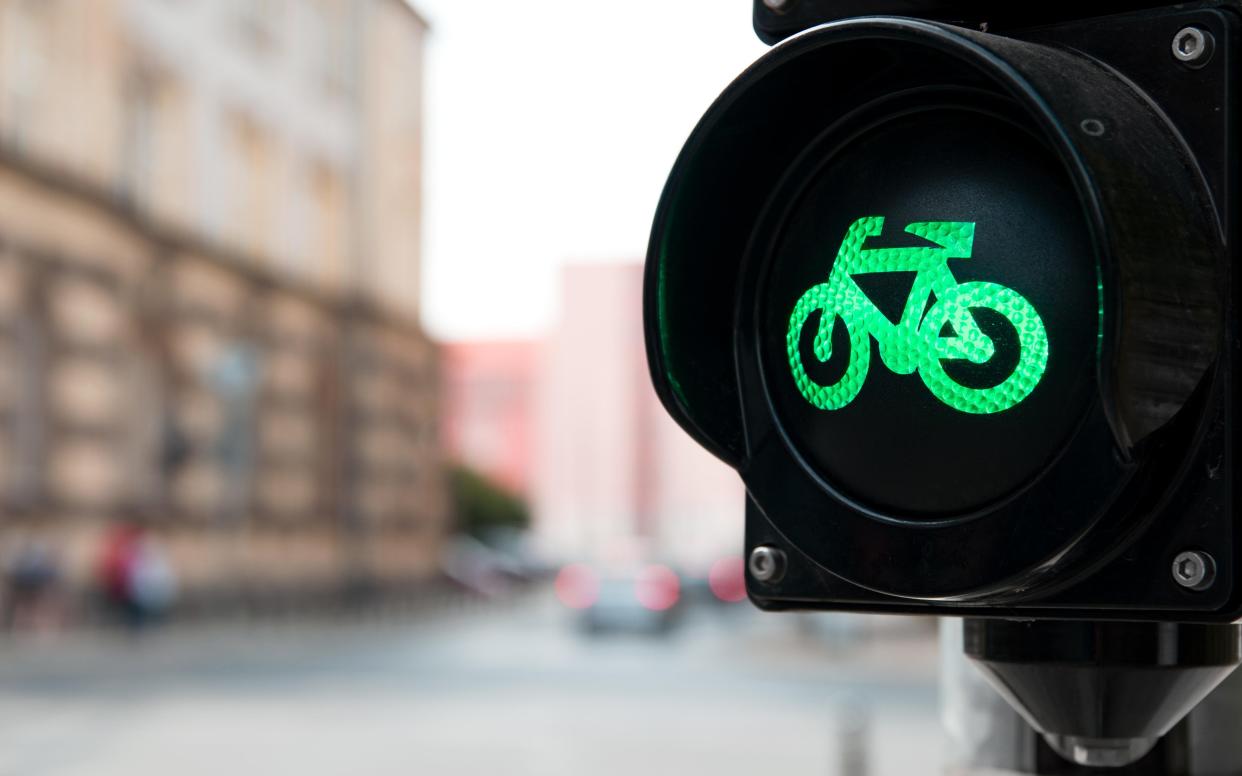 Green means go: as the number of cyclists rises, so too does spending on infrastructure - Credit: Daniel Krason / Alamy Stock Photo