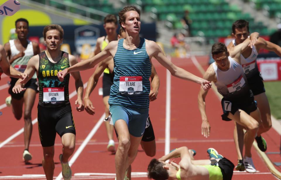 Cooper Teare, center, celebrates his victory in the men's 1,500 meters as the bodies of competitors fly behind on day three of the USA Track and Field Championships 2022 at Hayward Field in Eugene Saturday.