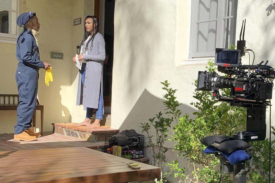 Leslie Odom Jr. and Nicolette Robinson act in front of a robotic camera.  (Photo: Freeform)