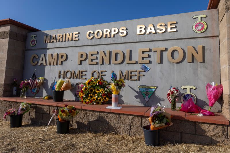 Flowers are shown placed at the main gate to U.S. Marine Base Camp Pendleton in Oceanside, California