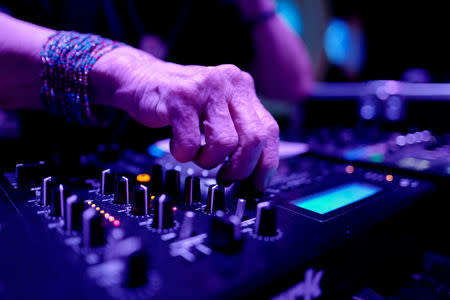 DJ Wika Szmyt, 80, plays music at a club in Warsaw, Poland March 25, 2019. Picture taken March 25, 2019. REUTERS/Kacper Pempel