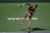 Maria Sakkari, of Greece, serves to Iga Swiatek, of Poland, during the women's singles finals at the BNP Paribas Open tennis tournament Sunday, March 20, 2022, in Indian Wells, Calif. (AP Photo/Marcio Jose Sanchez)