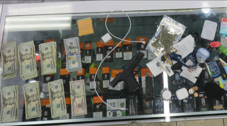 Authorities arrested a Riverside smoke shop employee for allegedly selling drugs, possessing an illegal firearm, setting up an illegal gambling operation and selling tobacco to minors at the store. Riverside PD announced the arrest on May 11, 2024. (KTLA)