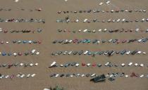 An aerial view of vehicles submerged in flood waters along the South Platte River near Greenley, Colorado September 14, 2013. Farming communities along the South Platte River were ordered to evacuate ahead of a predicted surge in the flooding which may have claimed a fifth life and has left many still unaccounted for, according to authorities. REUTERS/John Wark