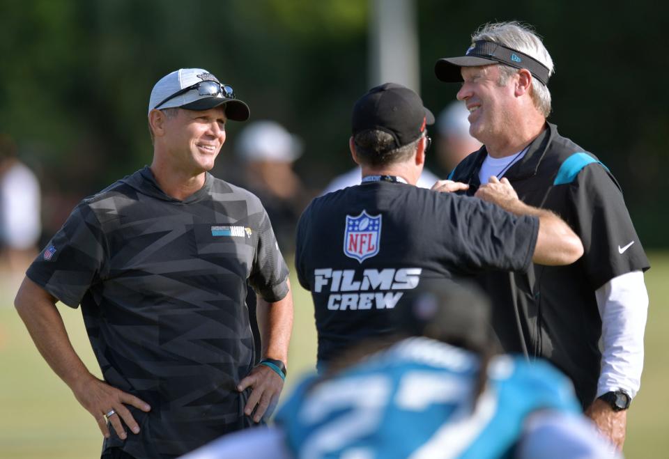 Jacksonville Jaguars General Manager Trent Baalke looks on as Jacksonville Jaguars head coach Doug Pederson is wired for a microphone during filing by NFL Films at Monday morning's training camp. The Jacksonville Jaguars held training camp Monday, August 1, 2022, at the Episcopal School of Jacksonville Knight Campus practice fields on Atlantic Blvd.