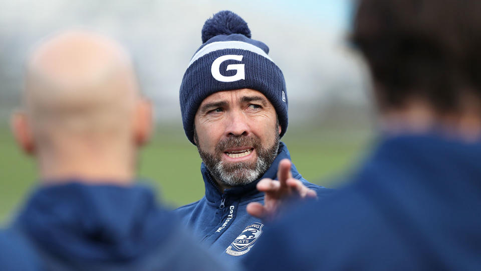 Pictured here, Geelong coach Chris Scott addresses his players.