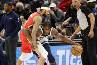 New Orleans Pelicans forward Brandon Ingram (14) pressures Minnesota Timberwolves forward Anthony Edwards (1) in the first half of an NBA basketball game, Monday, Oct. 25, 2021, in Minneapolis. (AP Photo/Andy Clayton-King)
