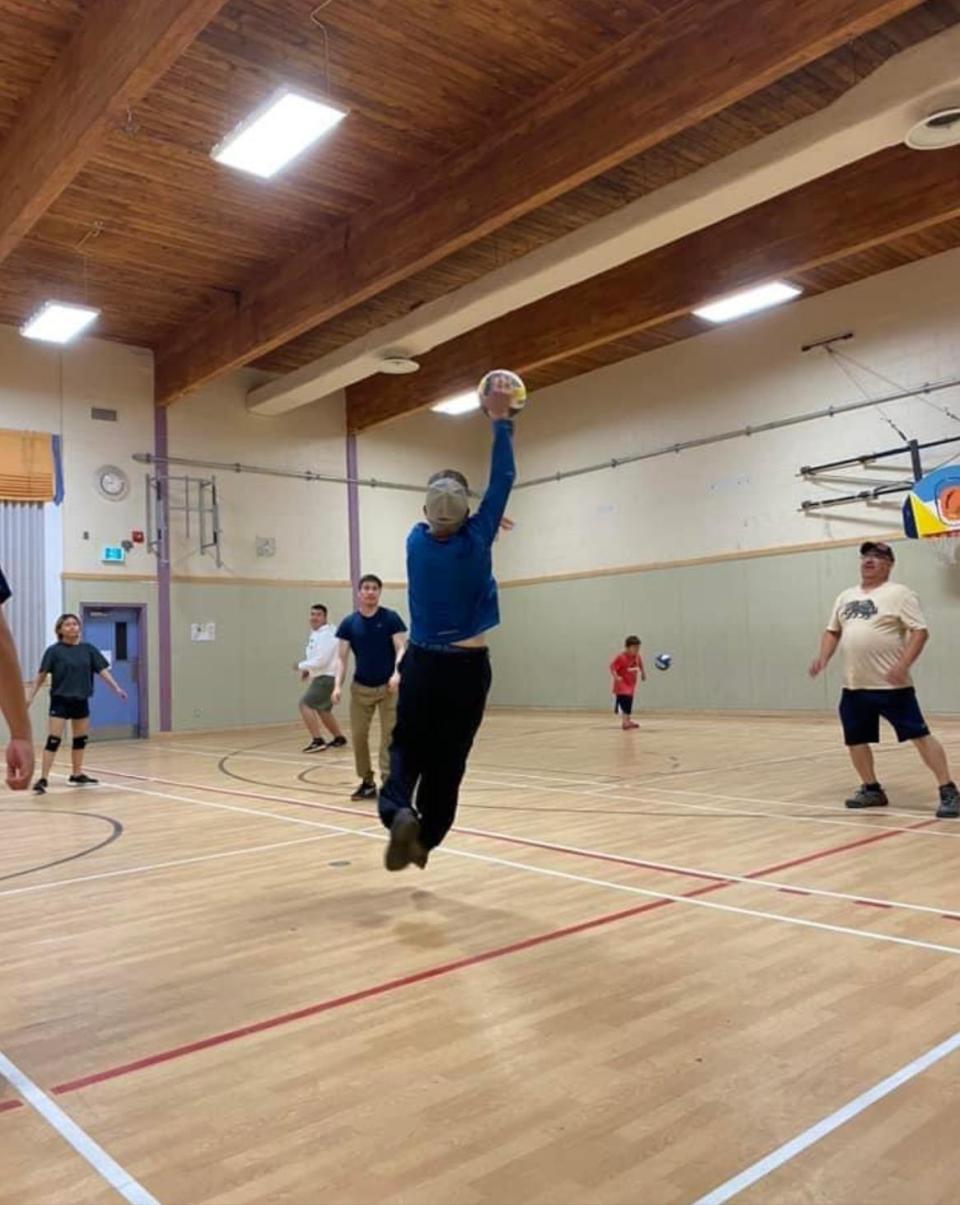 Robert Metabie jumps playing volleyball earlier this year. He plays four times a week and  encourages younger and older people to keep playing and keep having fun. 