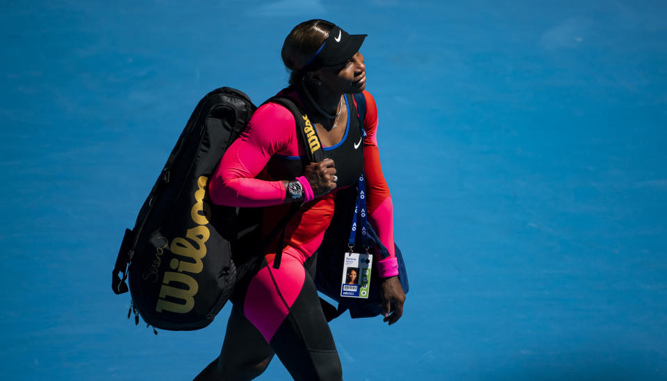 MELBOURNE, AUSTRALIA - FEBRUARY 18:  Serena Williams of the United States leaves the court after losing to Naomi Osaka of Japan in the women's singles semi-finals during day 11 of the 2021 Australian Open at Melbourne Park on February 18, 2021 in Melbourne, Australia. (Photo by TPN/Getty Images)