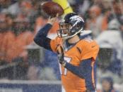 Denver Broncos quarterback Brock Osweiler (17) attempts to pass the football in the third quarter against the New England Patriots at Sports Authority Field at Mile High. Mandatory Credit: Ron Chenoy-USA TODAY Sports