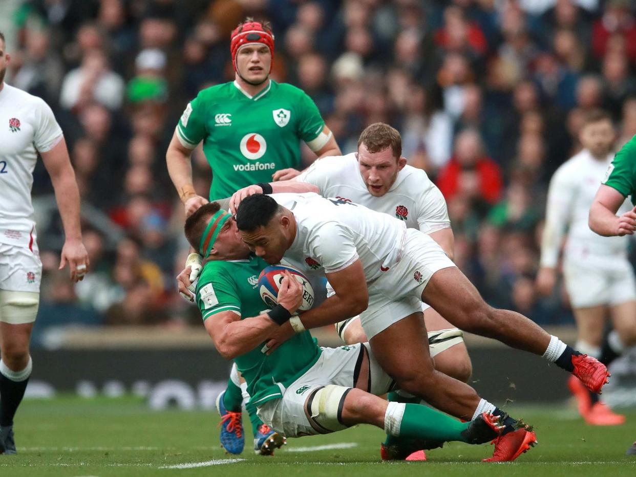 Manu Tuilagi tackles CJ Stander during England's Six Nations victory over Ireland: PA