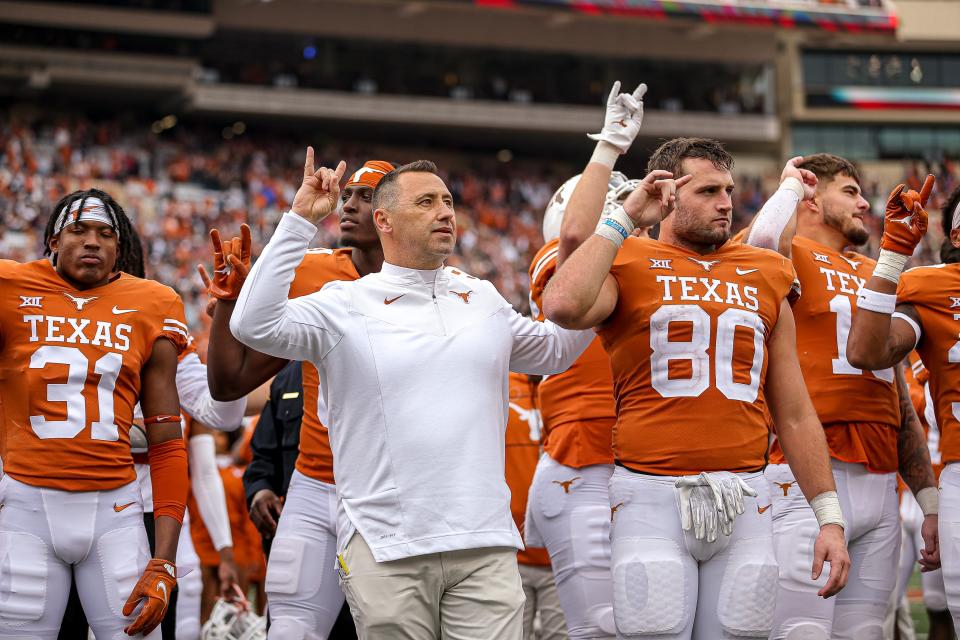 Texas head coach Steve Sarkisian, center, celebrates a 22-17 win over Kansas State with players in the final game of the season last year at Royal-Memorial Stadium. Texas Athletics just clinched a second consecutive Directors Cup, but the pressure is on the football team to rebound from a 5-7 season.