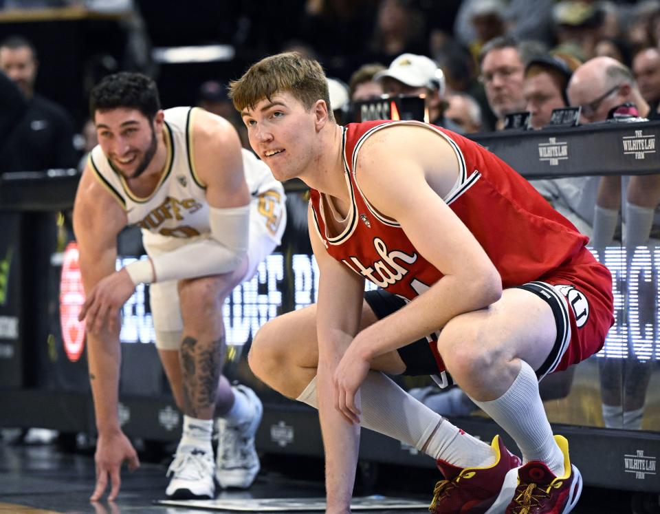 Utah forward Lawson Lovering, right, who used to play for Colorado, waits to check in as he makes his first appearance back in Boulder, Colo., in the first half of an NCAA college basketball game against Colorado, Saturday, Feb. 24, 2024. | Cliff Grassmick, Associated Press