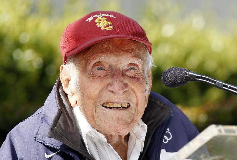 Louis Zamperini gestures during a news conference Friday May 9, 2014 in Pasadena, Calif. Ninety-seven-year-old World War II hero and former Olympian, Zamperini has been named grand marshal of the 2015 Rose Parade.(AP Photo/Nick Ut)