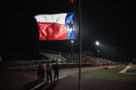 <p>A Texas flag flies at half mast during a prayer services at the La Vernia High School Football stadium to grieve the 26 victims killed at the First Baptist Church of Sutherland Springs on Nov. 7, 2017 in La Vernia, Texas. (Photo: Scott Olson/Getty Images) </p>