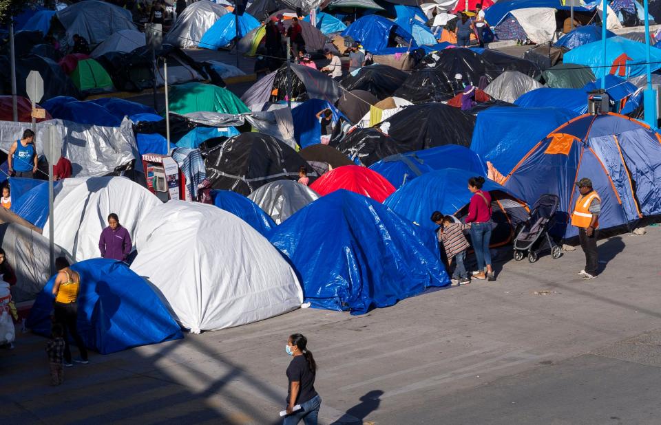 Over 1,000 migrants from Central America and Mexico live in a makeshift tent city in Tijuana at the Chaparral border crossing, across from the San Diego border. They said they would not leave until the Biden administration begins processing asylum seekers waiting at the U.S.-Mexico border.